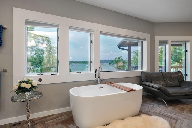 199 Cardinal Rd, Hollister, MO 65672 - full bath with a freestanding bath and baseboards