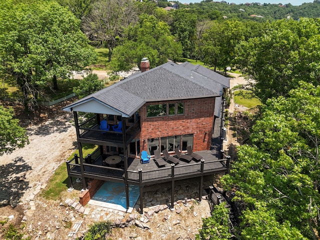 199 Cardinal Rd, Hollister, MO 65672 - rear view of property with a deck, a chimney, brick siding, and roof with shingles