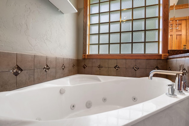 2661 E Ridgewood Dr, Springfield, MO 65804 - bathroom with a textured wall and a jetted tub