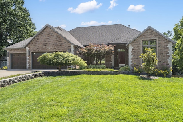 2661 E Ridgewood Dr, Springfield, MO 65804 - view of front of house featuring brick siding, a front lawn, concrete driveway, and a garage