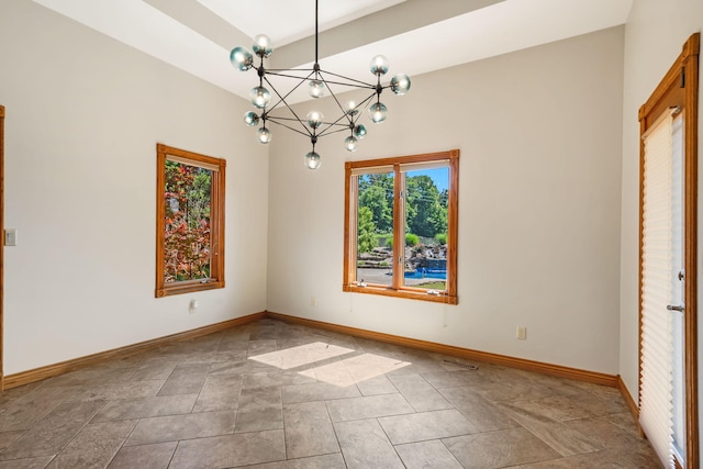 2661 E Ridgewood Dr, Springfield, MO 65804 - spare room featuring a chandelier and stone finish floors