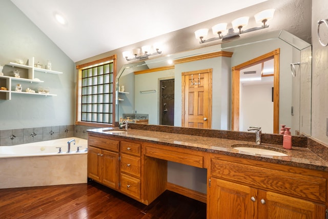 2661 E Ridgewood Dr, Springfield, MO 65804 - full bathroom featuring double vanity, hardwood / wood-style flooring, a garden tub, walk in shower, and vaulted ceiling