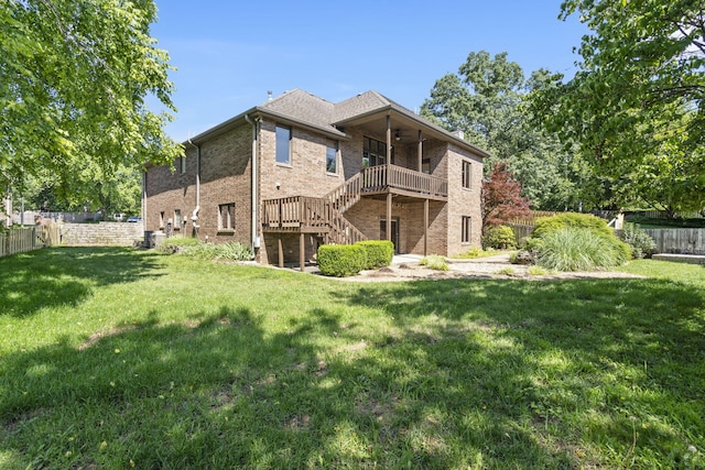 2661 E Ridgewood Dr, Springfield, MO 65804 - back of property featuring stairs, a ceiling fan, a fenced backyard, and brick siding