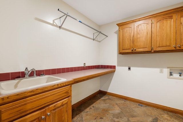 2661 E Ridgewood Dr, Springfield, MO 65804 - washroom with cabinet space, washer hookup, electric dryer hookup, and stone finish floors