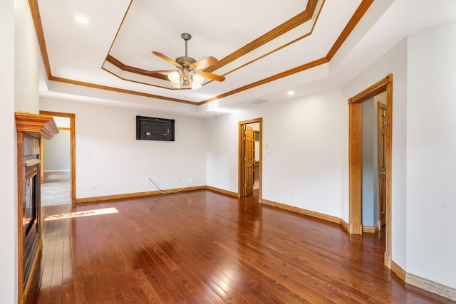 2661 E Ridgewood Dr, Springfield, MO 65804 - spare room with a raised ceiling, ornamental molding, hardwood / wood-style floors, ceiling fan, and a tiled fireplace