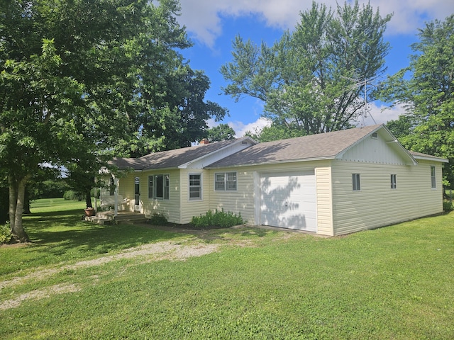1713 Wall Rd, Mountain Grove, MO 65711 - back of house featuring a lawn and a garage