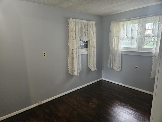 1713 Wall Rd, Mountain Grove, MO 65711 - unfurnished room with dark wood-style flooring and a textured ceiling