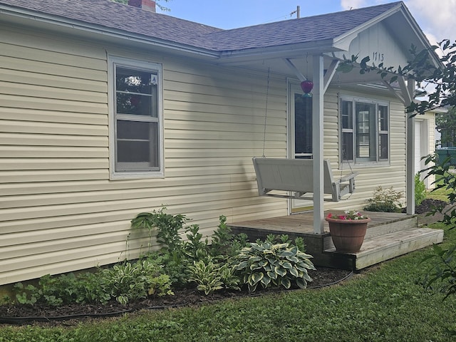 1713 Wall Rd, Mountain Grove, MO 65711 - view of side of property featuring a shingled roof and a chimney