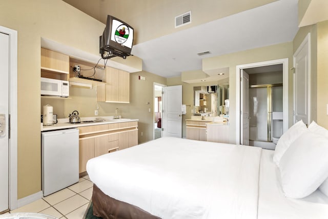 2800 Green Mountain Dr Unit 130A & D, Branson, MO 65616 - bedroom with light tile patterned floors and connected bathroom