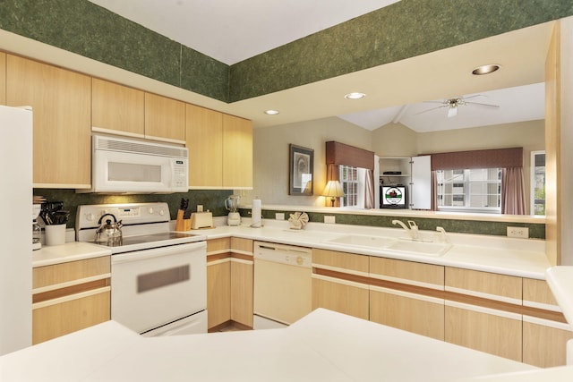 2800 Green Mountain Dr Unit 130A & D, Branson, MO 65616 - kitchen with white appliances, light brown cabinetry, a ceiling fan, decorative backsplash, and lofted ceiling