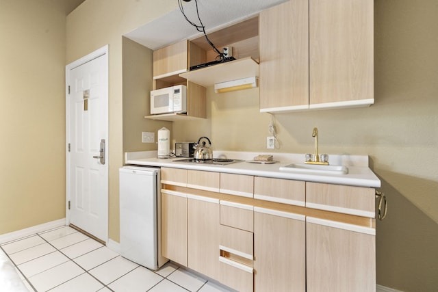 2800 Green Mountain Dr Unit 130A & D, Branson, MO 65616 - kitchen with light brown cabinets, white microwave, open shelves, and light countertops
