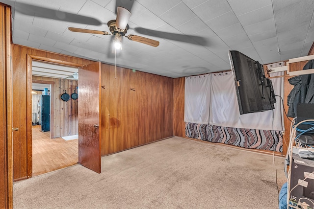 1215 Lanton Rd, West Plains, MO 65775 - basement featuring ceiling fan, carpet floors, and wooden walls
