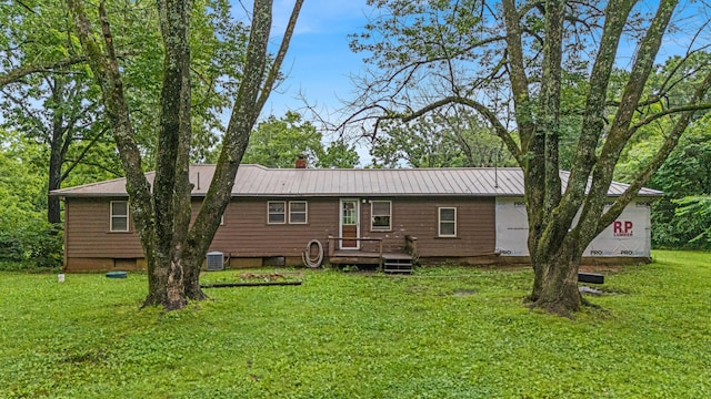 1215 Lanton Rd, West Plains, MO 65775 - back of house featuring a lawn and a metal roof