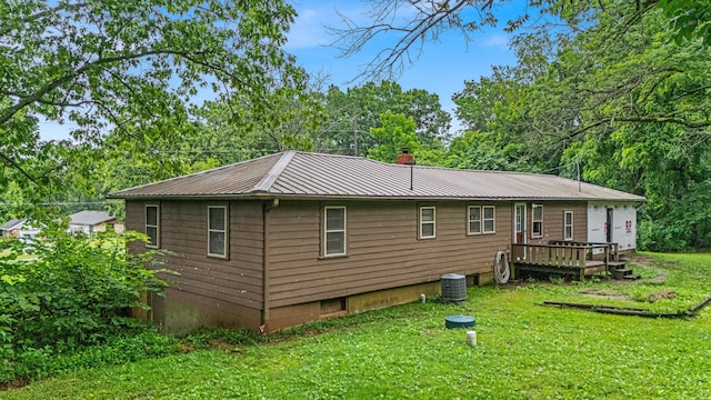 1215 Lanton Rd, West Plains, MO 65775 - back of house with a lawn, a chimney, a metal roof, and a wooden deck