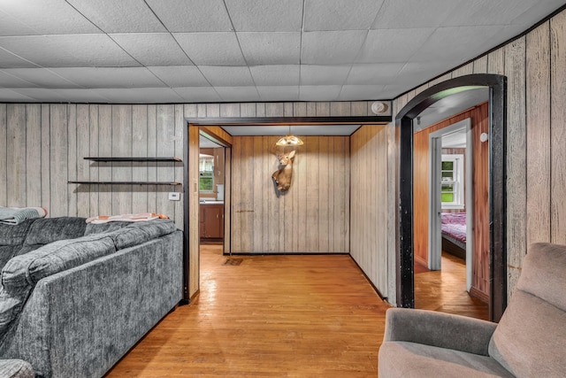 1215 Lanton Rd, West Plains, MO 65775 - living area with wooden walls, light wood finished floors, and arched walkways