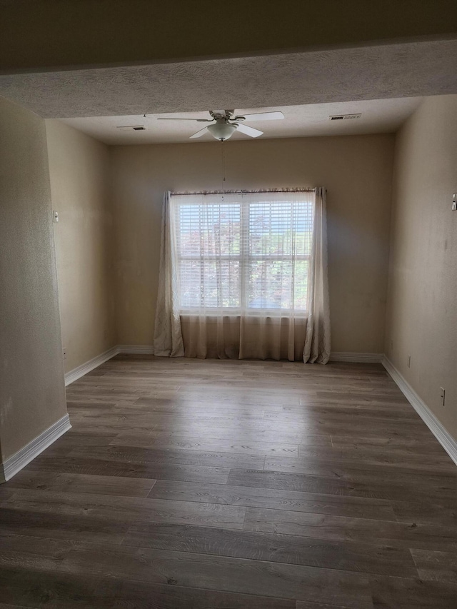 180 Grace Chapel Rd Unit 228, Blue Eye, MO 65611 - unfurnished room featuring a ceiling fan, wood finished floors, and a textured ceiling