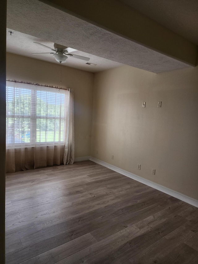 180 Grace Chapel Rd Unit 228, Blue Eye, MO 65611 - empty room with a ceiling fan, wood finished floors, and a textured ceiling
