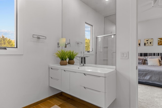 6298 E Summit View Dr, Springfield, MO 65809 - full bathroom with vanity, a stall shower, connected bathroom, and healthy amount of natural light