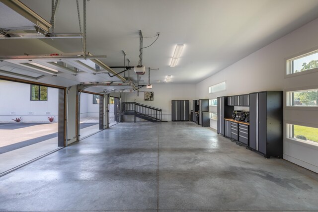 6298 E Summit View Dr, Springfield, MO 65809 - garage featuring a garage door opener