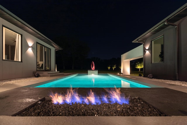 6298 E Summit View Dr, Springfield, MO 65809 - pool at twilight featuring a patio area and an outdoor pool