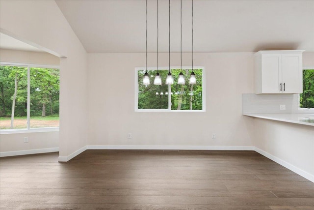 654 Rochester Rd, Sparta, MO 65753 - unfurnished dining area with dark wood finished floors and baseboards