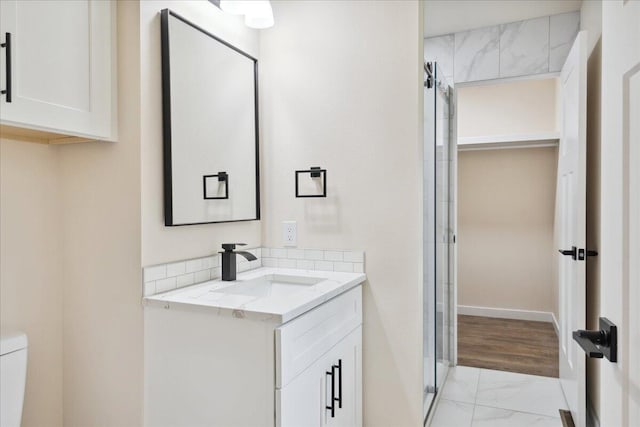 654 Rochester Rd, Sparta, MO 65753 - full bath with marble look tiles, vanity, and a shower stall