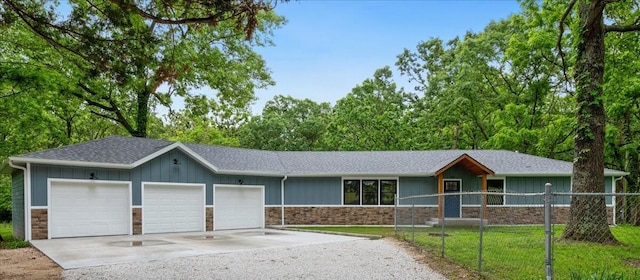 654 Rochester Rd, Sparta, MO 65753 - single story home with driveway, an attached garage, stone siding, roof with shingles, and board and batten siding
