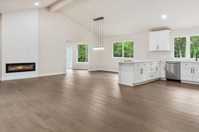 654 Rochester Rd, Sparta, MO 65753 - kitchen with dishwasher, a peninsula, healthy amount of natural light, beam ceiling, and white cabinetry