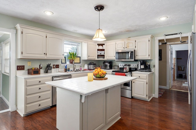3711 W Farm Road 14, Brighton, MO 65617 - kitchen with stainless steel appliances, white cabinets, dark wood finished floors, a textured ceiling, and recessed lighting