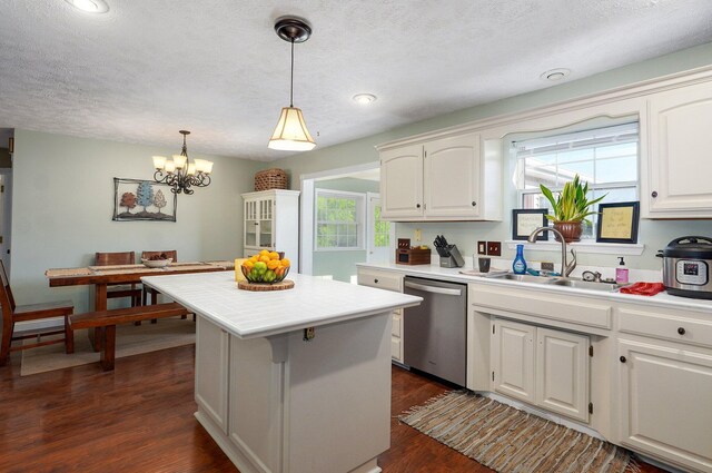 3711 W Farm Road 14, Brighton, MO 65617 - kitchen featuring dishwasher, a center island, light countertops, a chandelier, and dark wood-style floors