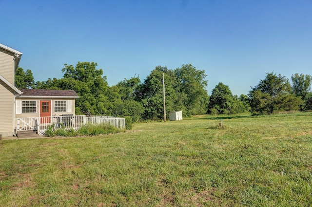 3711 W Farm Road 14, Brighton, MO 65617 - view of green lawn with a shed and a wooden deck