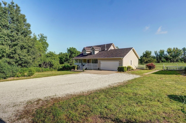 3711 W Farm Road 14, Brighton, MO 65617 - view of front facade with driveway, a garage, and covered porch
