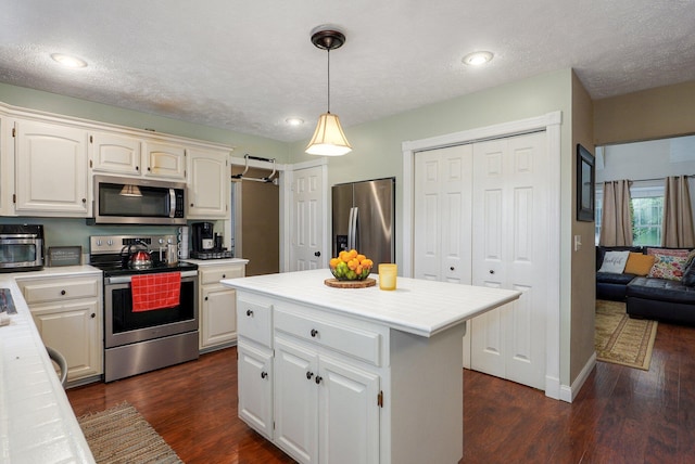 3711 W Farm Road 14, Brighton, MO 65617 - kitchen featuring stainless steel appliances, tile counters, white cabinetry, dark wood finished floors, and recessed lighting