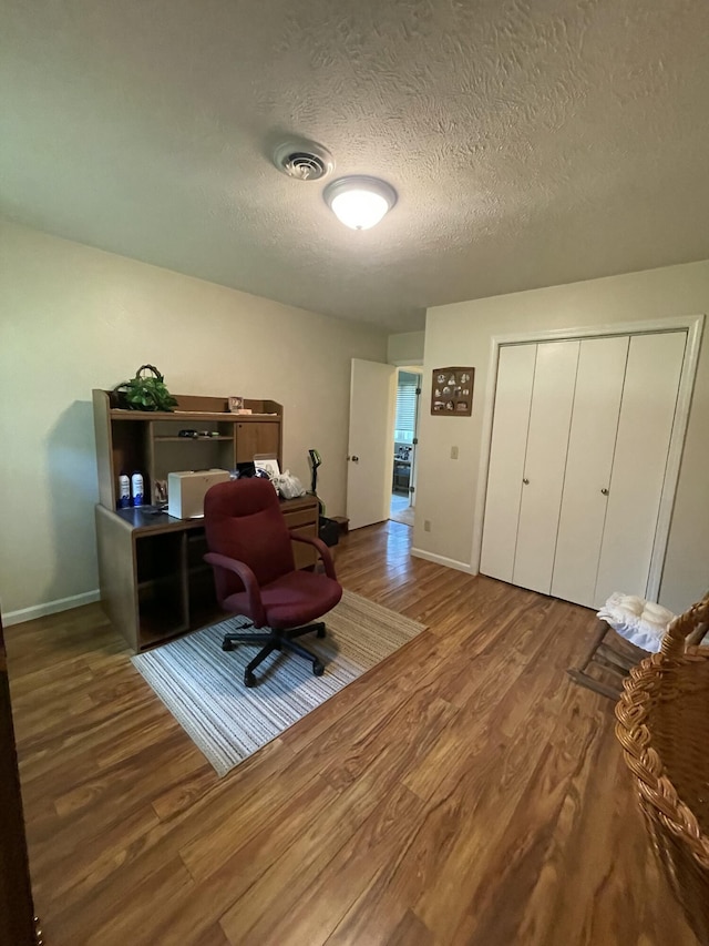 2105 Oakridge Dr, Ava, MO 65608 - office with wood finished floors and a textured ceiling