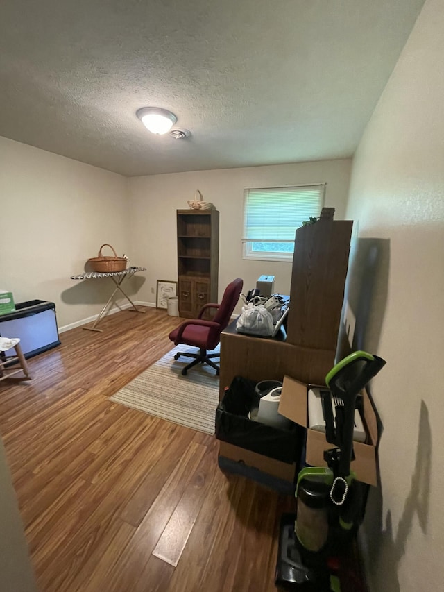 2105 Oakridge Dr, Ava, MO 65608 - home office featuring wood finished floors and a textured ceiling