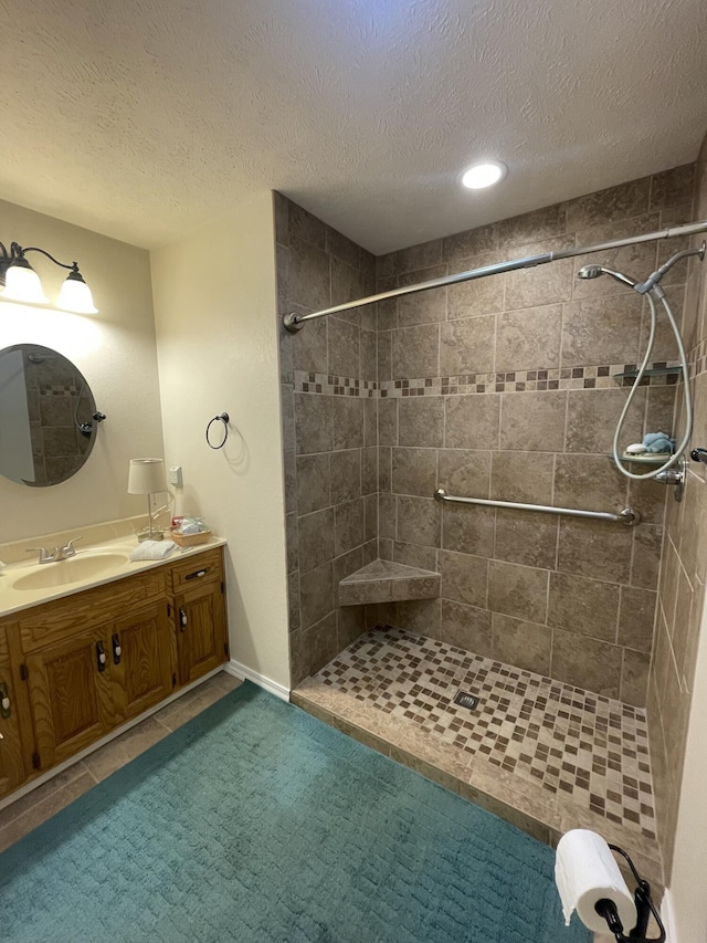2105 Oakridge Dr, Ava, MO 65608 - bathroom featuring vanity, a tile shower, a textured ceiling, and recessed lighting