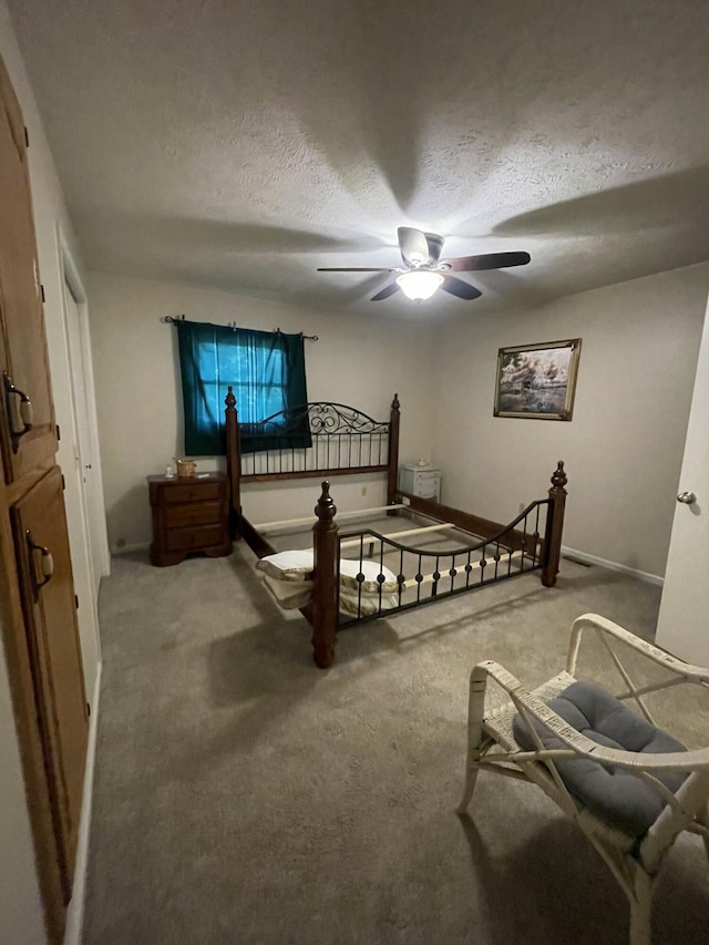 2105 Oakridge Dr, Ava, MO 65608 - bedroom with a textured ceiling, carpet, and ceiling fan