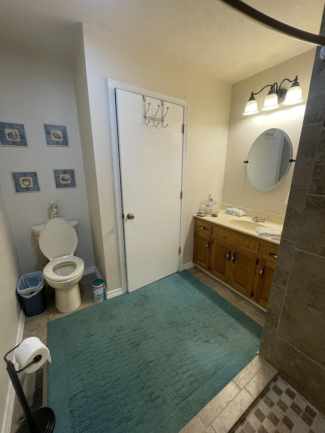 2105 Oakridge Dr, Ava, MO 65608 - half bath with vanity, tile patterned flooring, and a textured ceiling