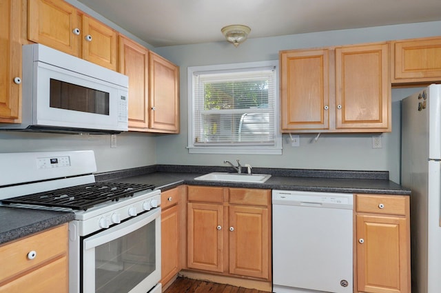 921 S Nettleton Ave, Springfield, MO 65806 - kitchen featuring white appliances, dark countertops, dark wood-type flooring, and light brown cabinetry