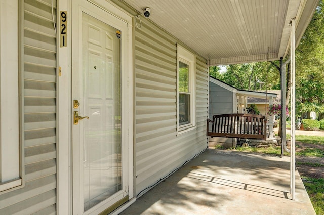 921 S Nettleton Ave, Springfield, MO 65806 - entrance to property featuring covered porch and a security system