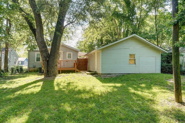 921 S Nettleton Ave, Springfield, MO 65806 - rear view of house with a lawn and a wooden deck