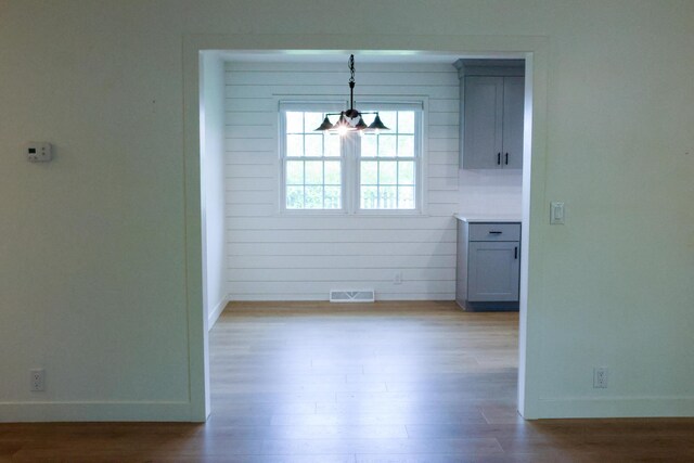 325 N Delaware Ave, Nixa, MO 65714 - unfurnished dining area featuring wood finished floors