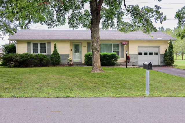 325 N Delaware Ave, Nixa, MO 65714 - ranch-style home featuring a garage, driveway, and a front yard
