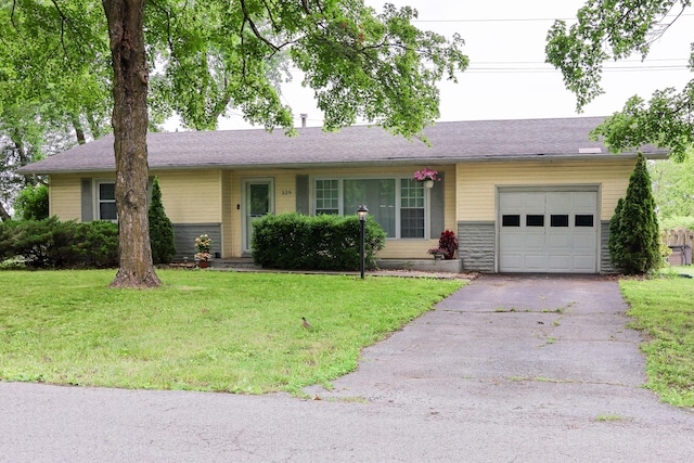 325 N Delaware Ave, Nixa, MO 65714 - ranch-style house featuring a garage, driveway, and a front yard