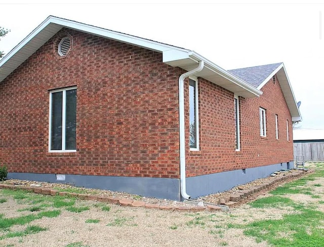 1301 W Blair Dr, Stockton, MO 65785 - view of side of property with brick siding and crawl space
