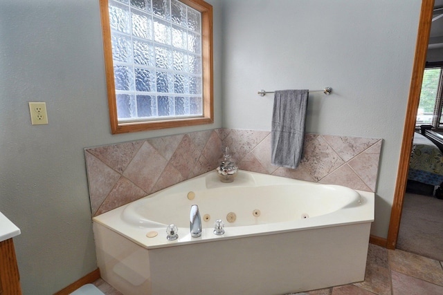 5150 S Dollison Ave, Springfield, MO 65810 - ensuite bathroom featuring a tub with jets and vanity