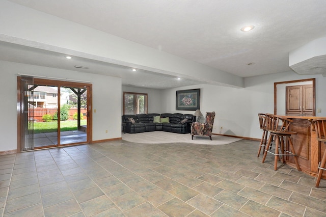 5150 S Dollison Ave, Springfield, MO 65810 - living room featuring recessed lighting, light tile patterned floors, and bar area