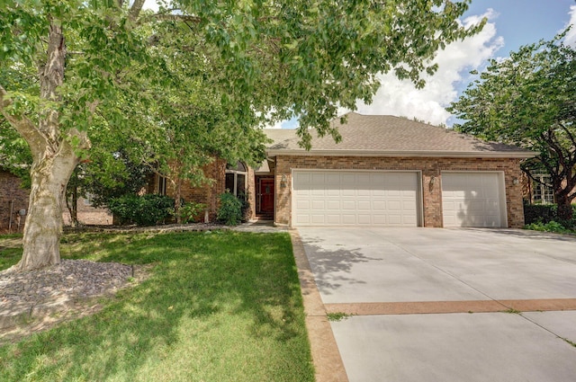 5150 S Dollison Ave, Springfield, MO 65810 - view of front of property with driveway, an attached garage, brick siding, and a front yard