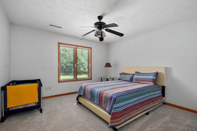 5150 S Dollison Ave, Springfield, MO 65810 - bedroom featuring carpet floors, a ceiling fan, and a textured ceiling