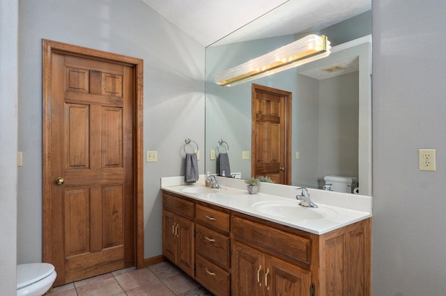 5150 S Dollison Ave, Springfield, MO 65810 - bathroom with double vanity, vaulted ceiling, and tile patterned flooring
